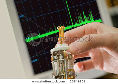 stock-photo-main-sensor-of-spectrometer-against-spectrum-on-a-screen-26849758.jpg